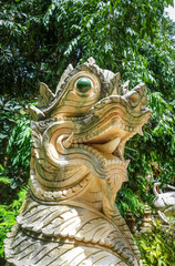 Fototapeta na wymiar White statue in Wat Palad temple, Chiang Mai, Thailand