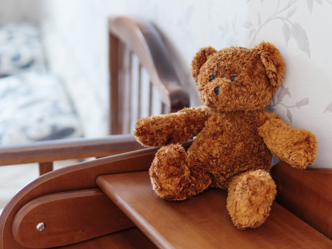 Teddy Bear On Wooden Dresser. Plush Toy In Kids Room.