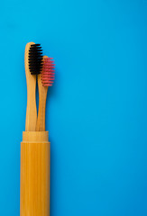 eco natural bamboo toothbrushes on blue background. zero waste flat lay 15