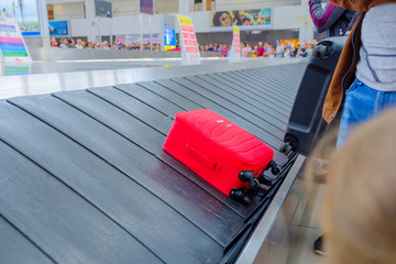 travel trunk at the airport on a conveyor belt