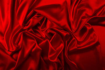 Fototapeta premium Red silk or satin luxury fabric texture can use as abstract background. Top view.