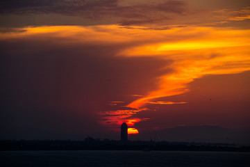 a vibrant blue and golden sunset in the swirling clouds of the izmir-Turkiye