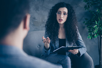 Portrait of her she nice attractive skilled wavy-haired girl psychologist shark expert sitting in...
