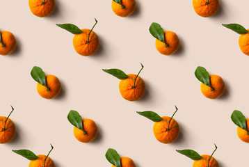 Mandarin pattern isolated on beige background. Fresh fruit.