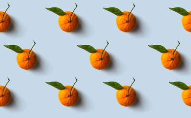 Mandarin pattern isolated on blue background. Fresh fruit.