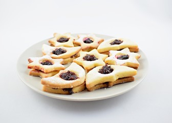 Homemade Christmas cookies star with jam and sugar powder