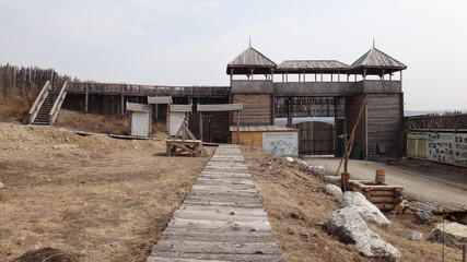 Fototapeta na wymiar reconstruction of old wooden houses and fortresses