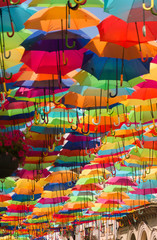 Fototapeta na wymiar Colorful umbrellas in the street. Agueda, Portugal