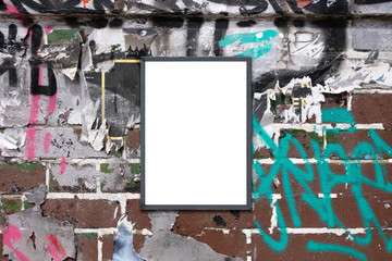 Blank notice advertising board for mockup on rough urban poster painted graffiti covered wall