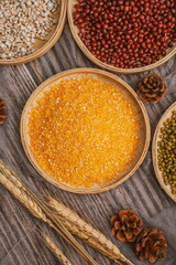 Chinese traditional grains in chinese steamer on wooden table. Made of maize, mung bean, chinese red bean. Chinese traditional food concept