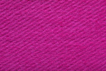 bright pink fine grain felt fabric. fiber texture polyester close-up. pink fleecy background. shaggy surface.