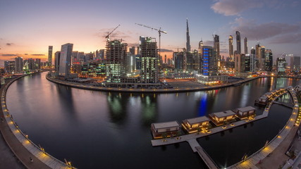 Fototapeta premium Dubai city center at sunset near river aerial timelapse
