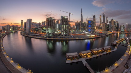 Fototapeta na wymiar Dubai city center at sunset near river aerial timelapse