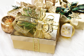 Christmas gift boxes in gold and white colors