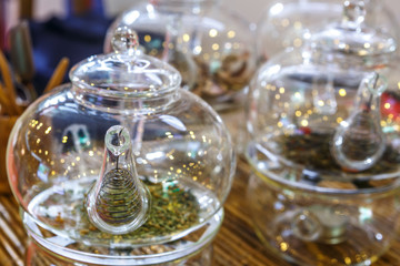 Fototapeta na wymiar Transparent glass teapots with loose-leaf tea