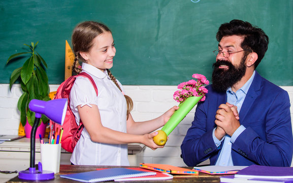 Girl Adorable Pupil With Backpack Giving Bouquet Flowers Teacher. Back To School. Best Wishes. Knowledge Day Congratulations. Greetings For School Pedagogue. School Holiday. Thankful Schoolgirl