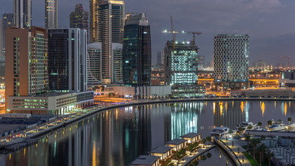 Fototapeta na wymiar The rhythm of the city of Dubai from night to morning transition aerial timelapse