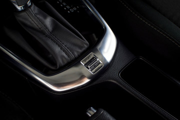 Obraz na płótnie Canvas Car sport and comfort mode button switch of automatic gear transmission in a luxury car.