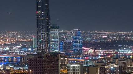 Fototapeta na wymiar Nighttime rhythm of the city of Dubai aerial timelapse