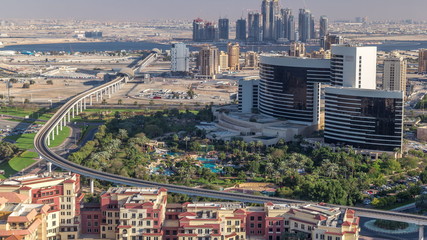 View of new modern buildings and high traffic in luxury Dubai city, United Arab Emirates Timelapse Aerial