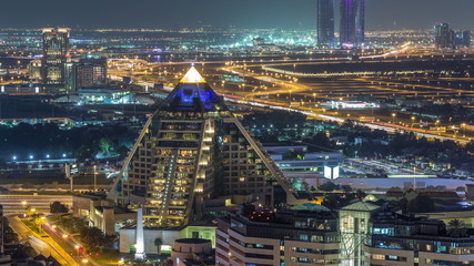 Fototapeta premium The rhythm of the night city of Dubai aerial timelapse