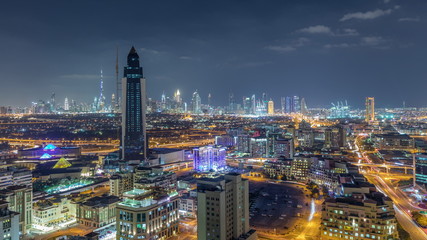 Fototapeta na wymiar Nighttime view of lights in luxury Dubai city, United Arab Emirates Timelapse Aerial
