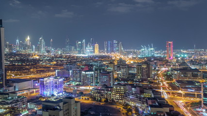 Fototapeta na wymiar Nighttime view of lights in luxury Dubai city, United Arab Emirates Timelapse Aerial