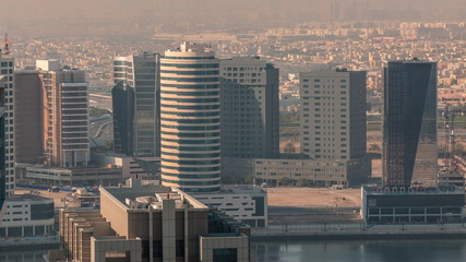 Dubai's business bay towers at morning aerial timelapse.