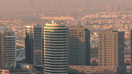 Dubai's business bay towers at morning aerial timelapse.