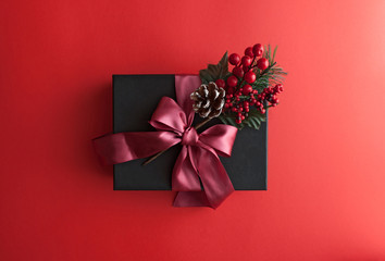 Merry christmas red background with black gift box