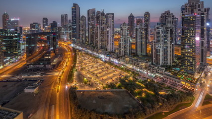 Fototapeta na wymiar View of new modern buildings in luxury Dubai city, United Arab Emirates Timelapse Aerial