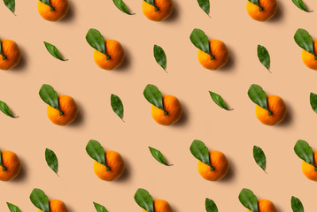 Mandarin pattern isolated on orange background. Fresh fruit.