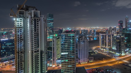 Dubai's business bay towers aerial night timelapse.