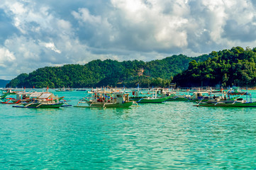 Local boats (bancas) in El Nido bay in  Palawan, Philippines.  Holiday and vacation.
