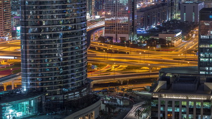 Fototapeta na wymiar Aerial view of highway interchange in Dubai downtown night timelapse.