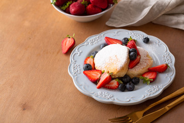Trendy homemade japanese pancakes for breakfast with berries