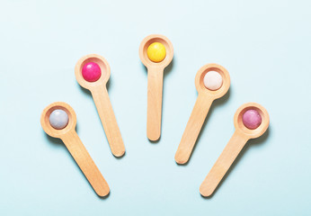 Wooden colorful spoons background