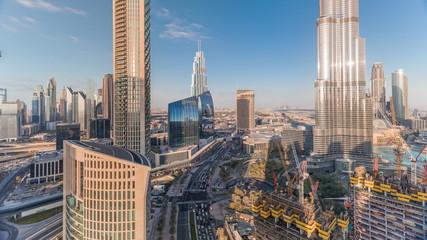 Fototapeta na wymiar Panoramic skyline view of Dubai downtown with mall, fountains and skyscrapers aerial timelapse