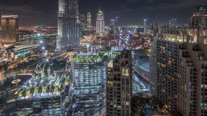 Fototapeta na wymiar Amazing aerial view of Dubai downtown skyscrapers night timelapse, Dubai, United Arab Emirates