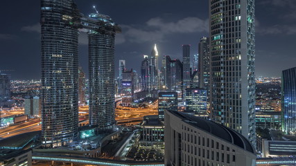 Obraz na płótnie Canvas Aerial night view of new skyscrapers and tall buildings Timelapse