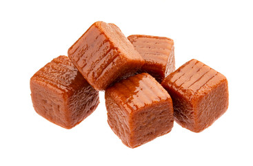 Caramel candies isolated on white background