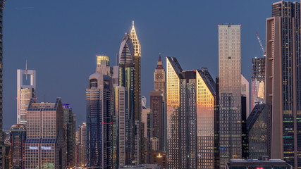 Fototapeta na wymiar Aerial view of new skyscrapers and tall buildings in Dubai day to night timelapse