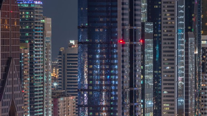 Fototapeta na wymiar Dubai International Financial Centre district with modern skyscrapers night timelapse