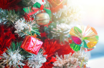 Blurry of Christmas and New Year's balls with beautiful decorations on the Christmas tree, soft light, beautiful background images and illustrations.