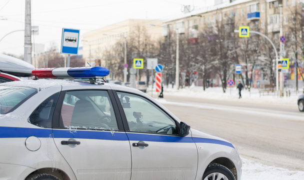 traffic police car with photo and video recording stands for observation in front of the city pedestrian crossing in the winter