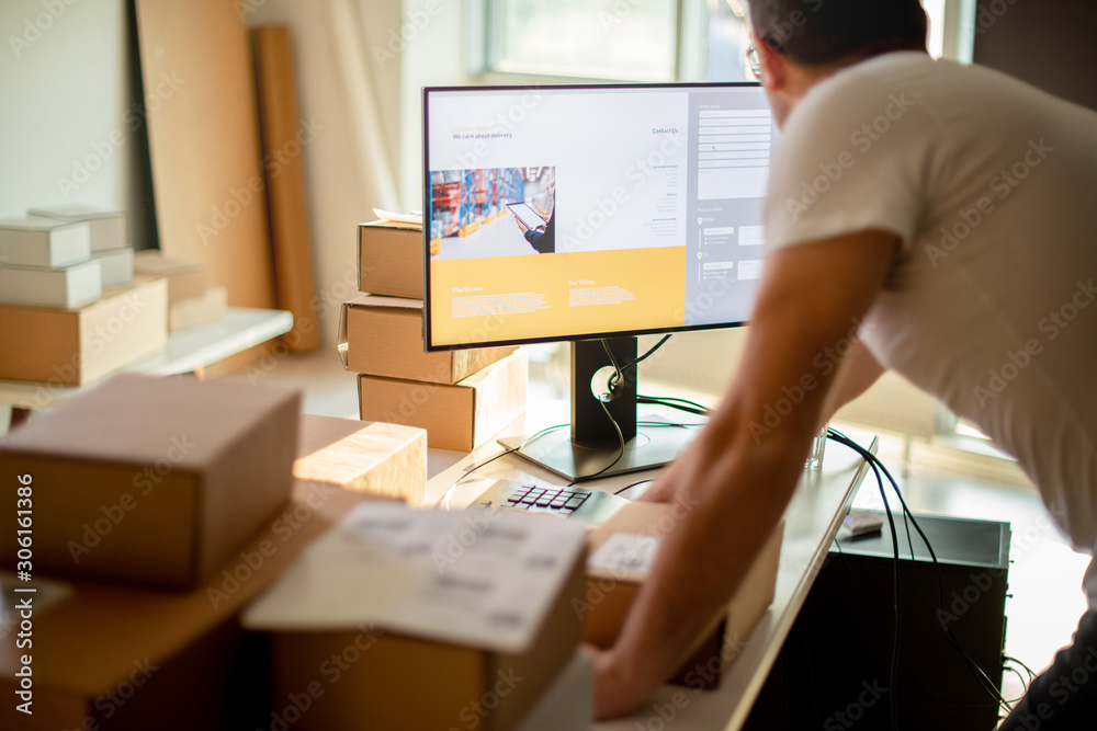 Wall mural Young Man Working in Delivery service	