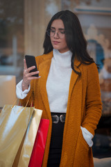 young woman with shopping bags