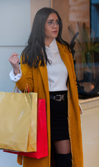 young woman with shopping bags
