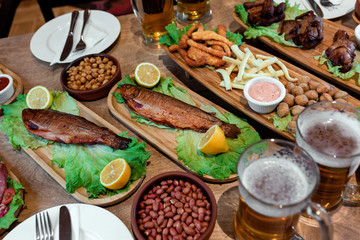 table with lots of snacks and beer 1