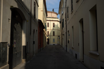 Fototapeta na wymiar empty and solitary alley in the morning, Italy Forlì